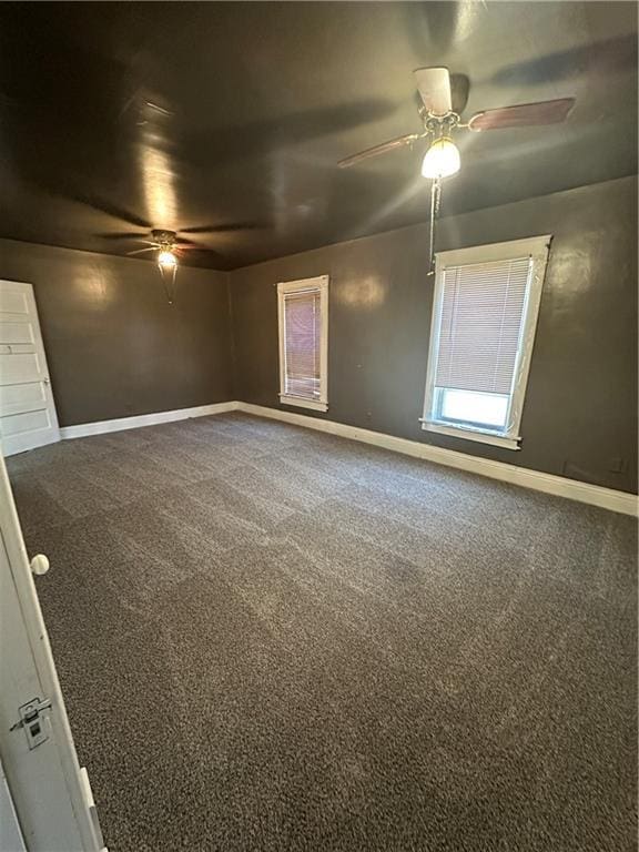 236 N Liberty St, Troy, KS 66087 - carpeted spare room with baseboards and ceiling fan