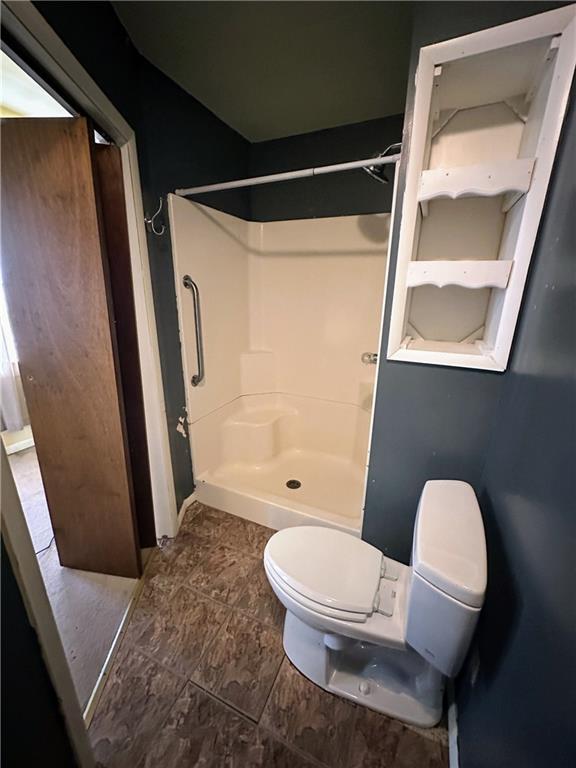 236 N Liberty St, Troy, KS 66087 - bathroom with a stall shower and toilet