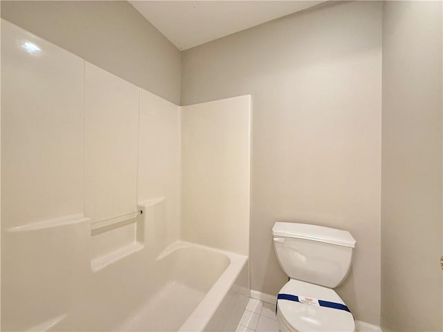 bathroom with tile patterned floors, toilet, and baseboards