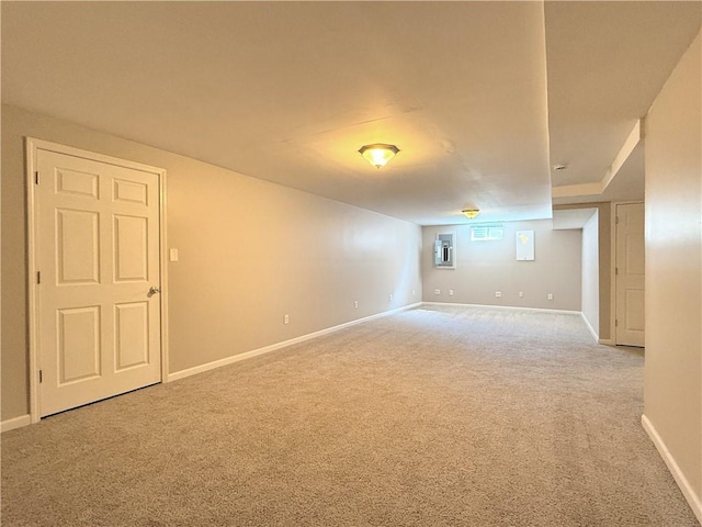 carpeted empty room with baseboards