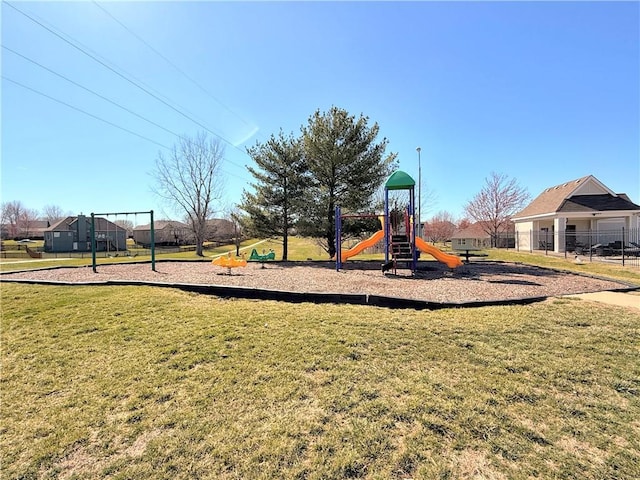 communal playground featuring a yard