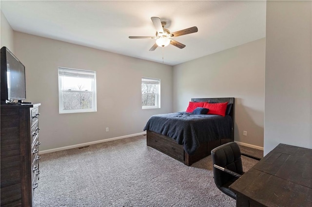 bedroom featuring baseboards, a ceiling fan, and carpet flooring