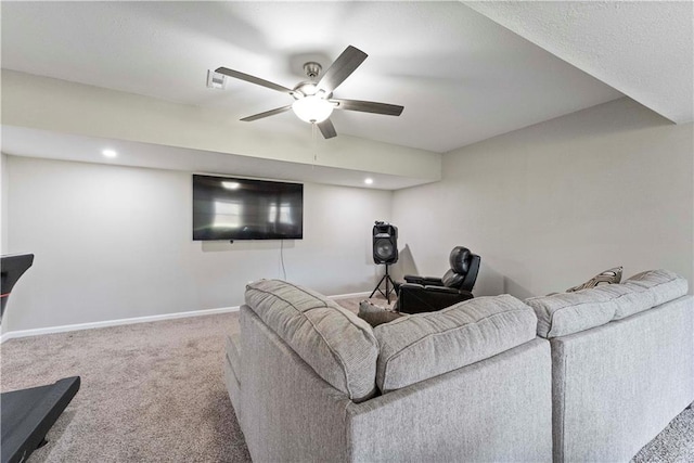 carpeted living area featuring a ceiling fan, baseboards, and recessed lighting