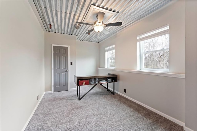 office with carpet floors, a ceiling fan, and baseboards