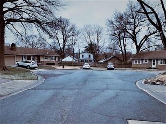 view of road featuring curbs