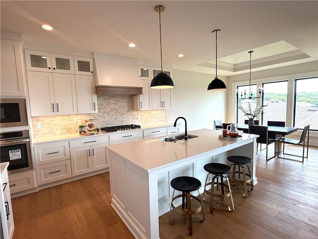 2317 SW Morris Dr, Lees Summit, MO 64082 - kitchen with a sink, stainless steel appliances, white cabinets, tasteful backsplash, and recessed lighting