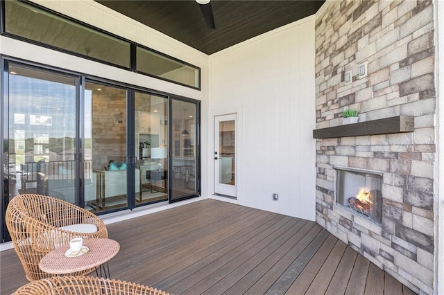 2317 SW Morris Dr, Lees Summit, MO 64082 - wooden deck featuring a stone fireplace and ceiling fan