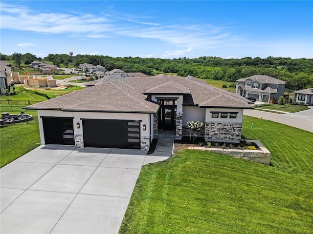 2317 SW Morris Dr, Lees Summit, MO 64082 - view of front of property featuring stone siding, an attached garage, concrete driveway, a front lawn, and a shingled roof