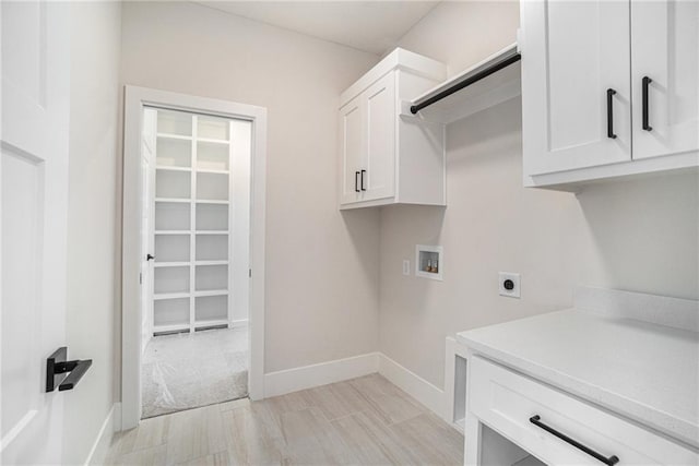 2317 SW Morris Dr, Lees Summit, MO 64082 - washroom featuring hookup for an electric dryer, cabinet space, and washer hookup