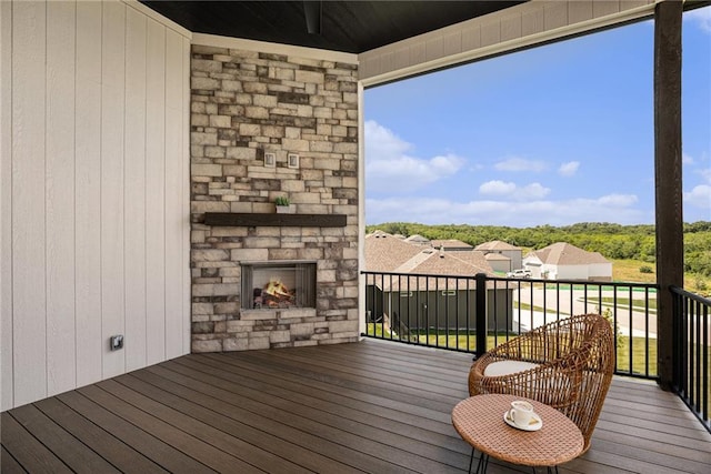 2317 SW Morris Dr, Lees Summit, MO 64082 - wooden deck featuring an outdoor stone fireplace