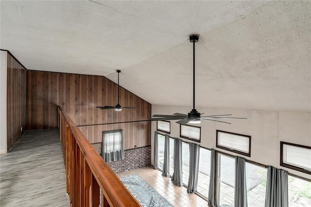 134 Timber Valley Dr, Linn Valley, KS 66040 - hall with a textured ceiling, wood walls, and lofted ceiling
