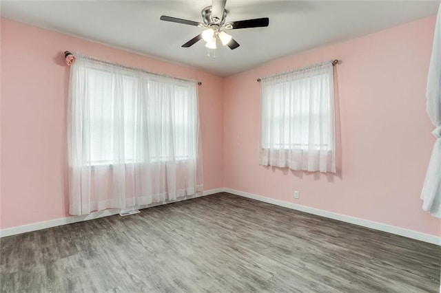 134 Timber Valley Dr, Linn Valley, KS 66040 - spare room with baseboards, a ceiling fan, wood finished floors, and visible vents