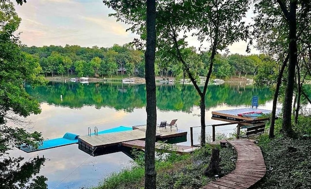 134 Timber Valley Dr, Linn Valley, KS 66040 - dock area featuring a water view and a wooded view