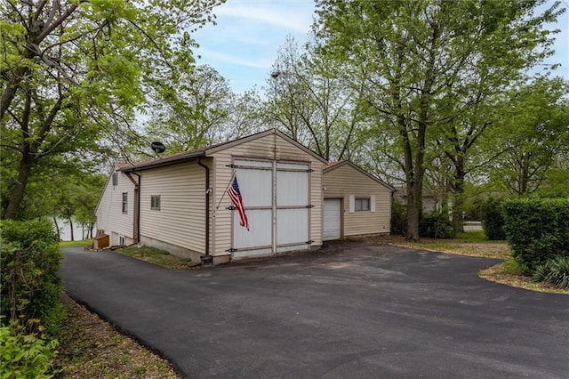 134 Timber Valley Dr, Linn Valley, KS 66040 - detached garage with a shed