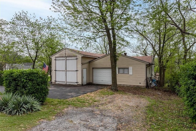 134 Timber Valley Dr, Linn Valley, KS 66040 - garage with aphalt driveway