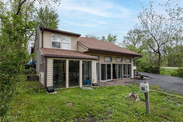 134 Timber Valley Dr, Linn Valley, KS 66040 - rear view of property with a lawn