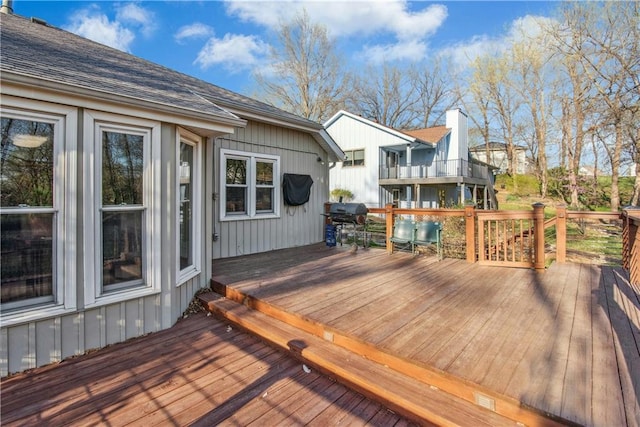 wooden terrace featuring area for grilling
