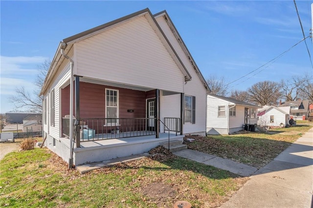 208 E 5th St, Carrollton, MO 64633 - view of front of property with a porch and crawl space