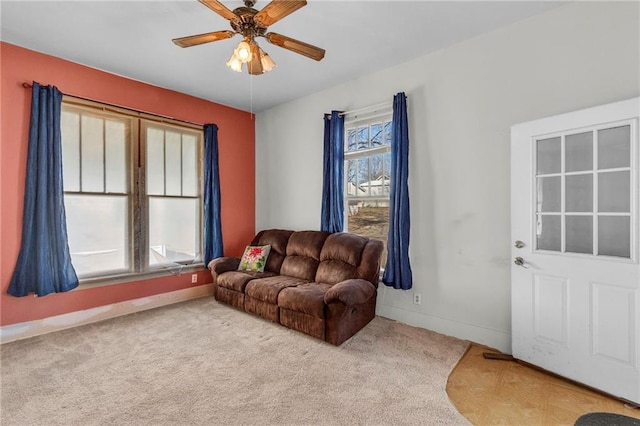 208 E 5th St, Carrollton, MO 64633 - living room with carpet, baseboards, and ceiling fan