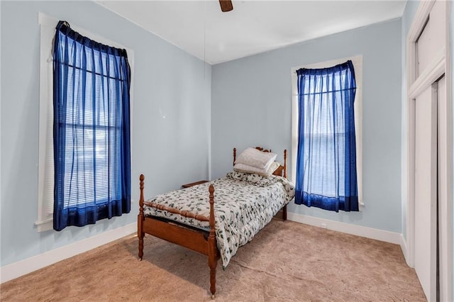 208 E 5th St, Carrollton, MO 64633 - bedroom with carpet flooring, ceiling fan, and baseboards