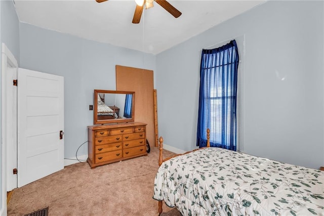 208 E 5th St, Carrollton, MO 64633 - bedroom with ceiling fan and light carpet