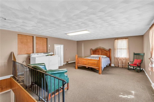 208 E 5th St, Carrollton, MO 64633 - carpeted bedroom featuring baseboards, independent washer and dryer, and a textured ceiling