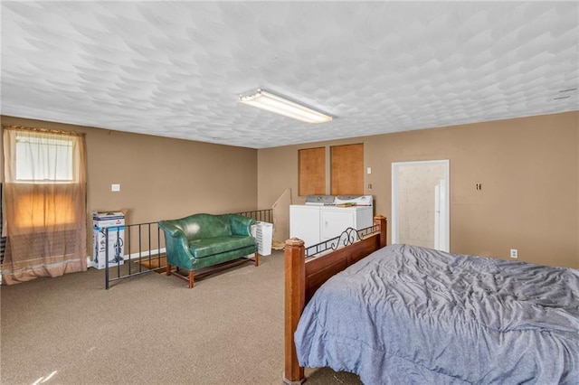 208 E 5th St, Carrollton, MO 64633 - carpeted bedroom featuring washing machine and clothes dryer and a textured ceiling