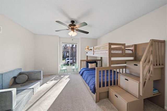 carpeted bedroom featuring access to outside and baseboards