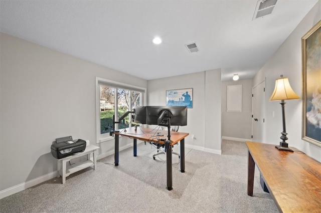 office area featuring light colored carpet, baseboards, and visible vents