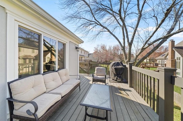 wooden deck featuring an outdoor living space