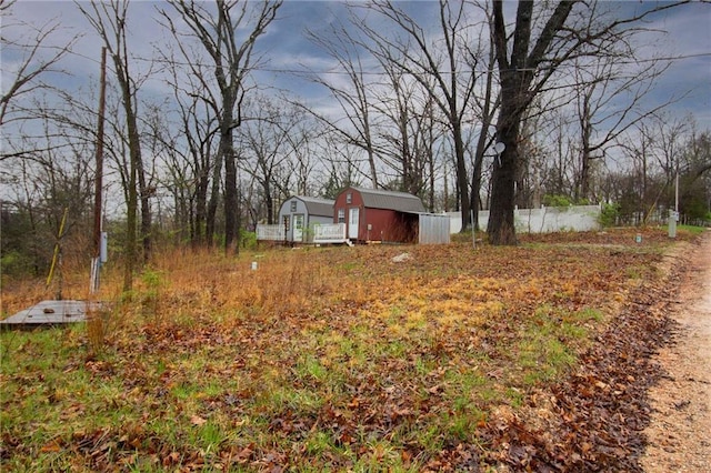 3819 Dogwood Dr, Stover, MO 65078 - view of yard with a storage shed, fence, and an outdoor structure