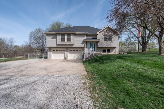 6620 NW 136th St, Kansas City, MO 64164 - split foyer home featuring a front lawn, fence, an attached garage, and concrete driveway