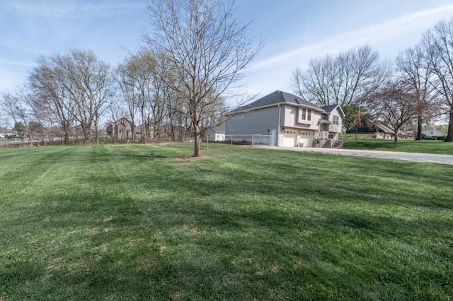 6620 NW 136th St, Kansas City, MO 64164 - view of yard with a garage