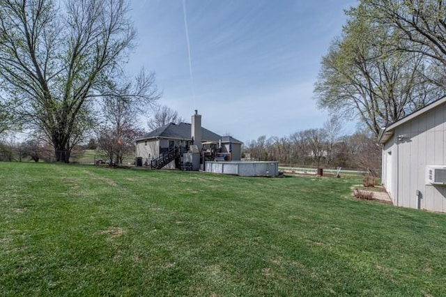 6620 NW 136th St, Kansas City, MO 64164 - view of yard with stairway and an outdoor pool