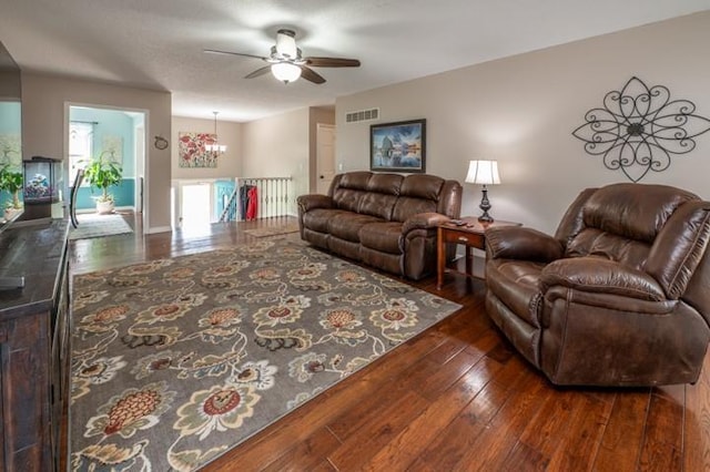 6620 NW 136th St, Kansas City, MO 64164 - living room with wood-type flooring, visible vents, and ceiling fan with notable chandelier