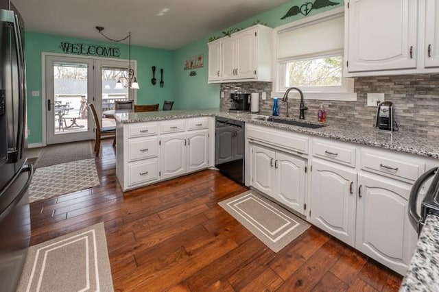 6620 NW 136th St, Kansas City, MO 64164 - kitchen with tasteful backsplash, white cabinets, a sink, a peninsula, and black appliances
