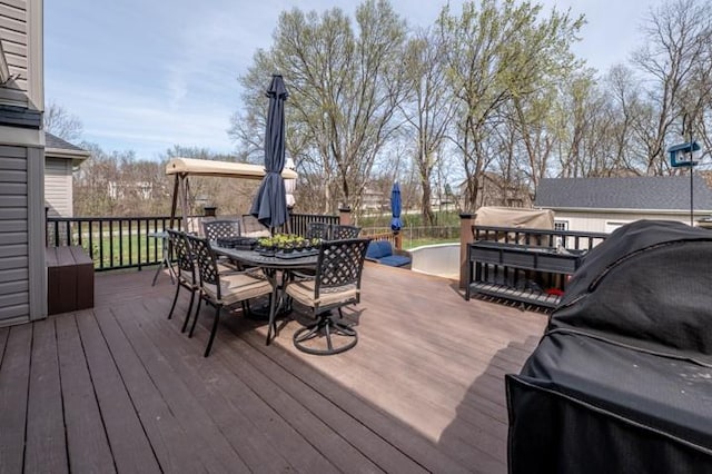 6620 NW 136th St, Kansas City, MO 64164 - wooden deck with a grill and outdoor dining area