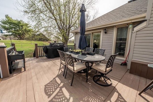 6620 NW 136th St, Kansas City, MO 64164 - deck featuring grilling area, outdoor dining space, and a yard