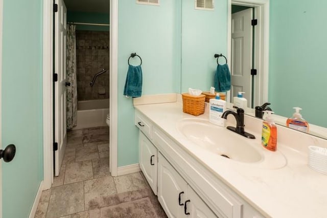 6620 NW 136th St, Kansas City, MO 64164 - full bath with vanity, baseboards, toilet, visible vents, and stone finish flooring