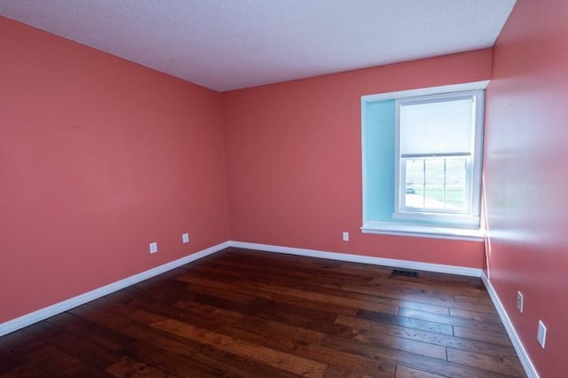 6620 NW 136th St, Kansas City, MO 64164 - spare room featuring dark wood-style flooring and baseboards
