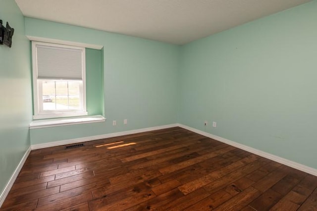 6620 NW 136th St, Kansas City, MO 64164 - spare room featuring baseboards and hardwood / wood-style floors