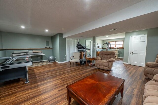6620 NW 136th St, Kansas City, MO 64164 - living room with recessed lighting, baseboards, a textured ceiling, and wood finished floors