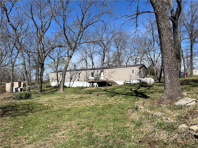 3672 Haynes Hill Rd, Bates City, MO 64011 - view of green lawn with a deck