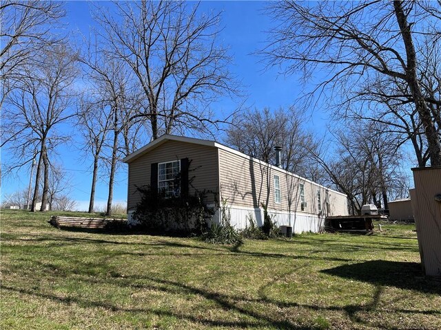 3672 Haynes Hill Rd, Bates City, MO 64011 - view of side of home with a lawn
