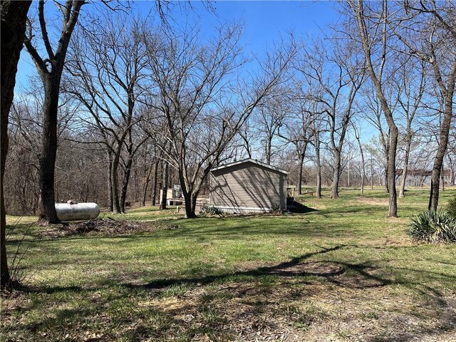 3672 Haynes Hill Rd, Bates City, MO 64011 - view of grassy yard with an outdoor structure