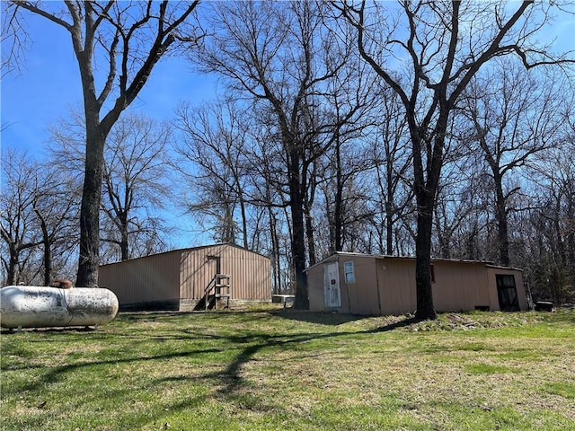 3672 Haynes Hill Rd, Bates City, MO 64011 - view of grassy yard with an outbuilding and an outdoor structure