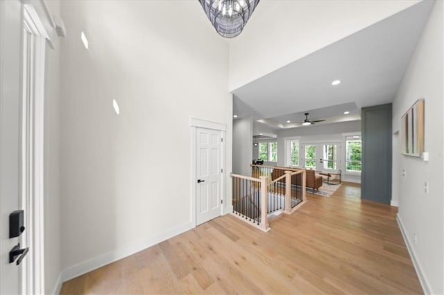 foyer with recessed lighting, baseboards, ceiling fan, and light wood-style floors