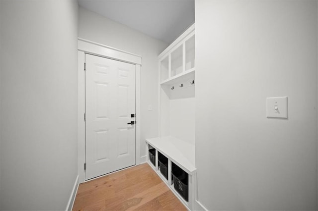mudroom featuring light wood-style floors and baseboards