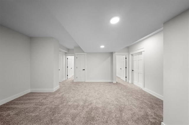 finished basement featuring baseboards, carpet flooring, and recessed lighting