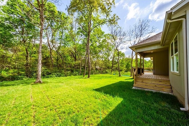 view of yard with a deck